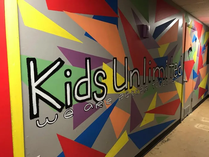 The colorful Kids Unlimited mural shown in the church’s public ministry gallery.